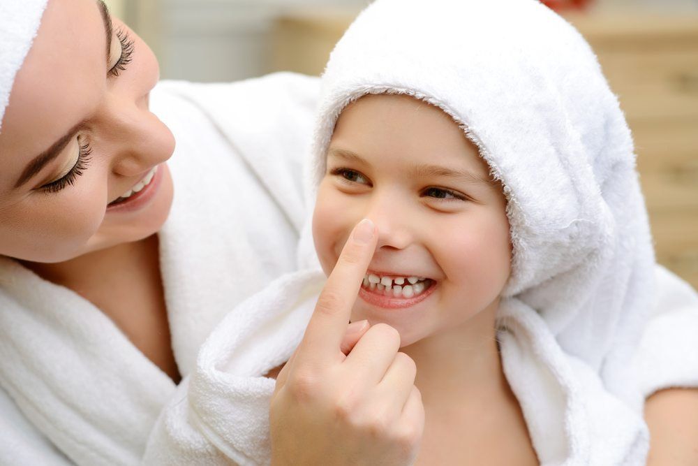 Mother and child after bath happy with water heater solution